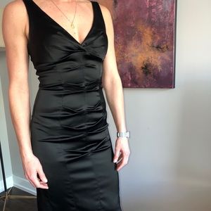 Sleeveless ruched satin dress.